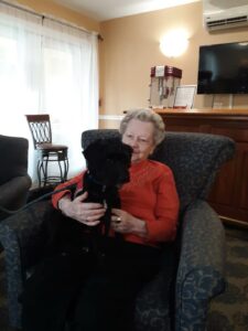 Therapy dog visiting Sunapee Cove Assisted Living